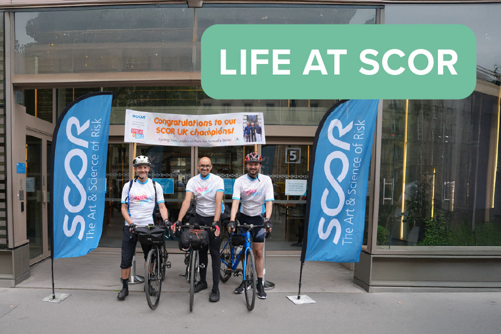 May 2025 Life at SCOR Careers Blog post thumbnail with the SCOR Champions on their bike