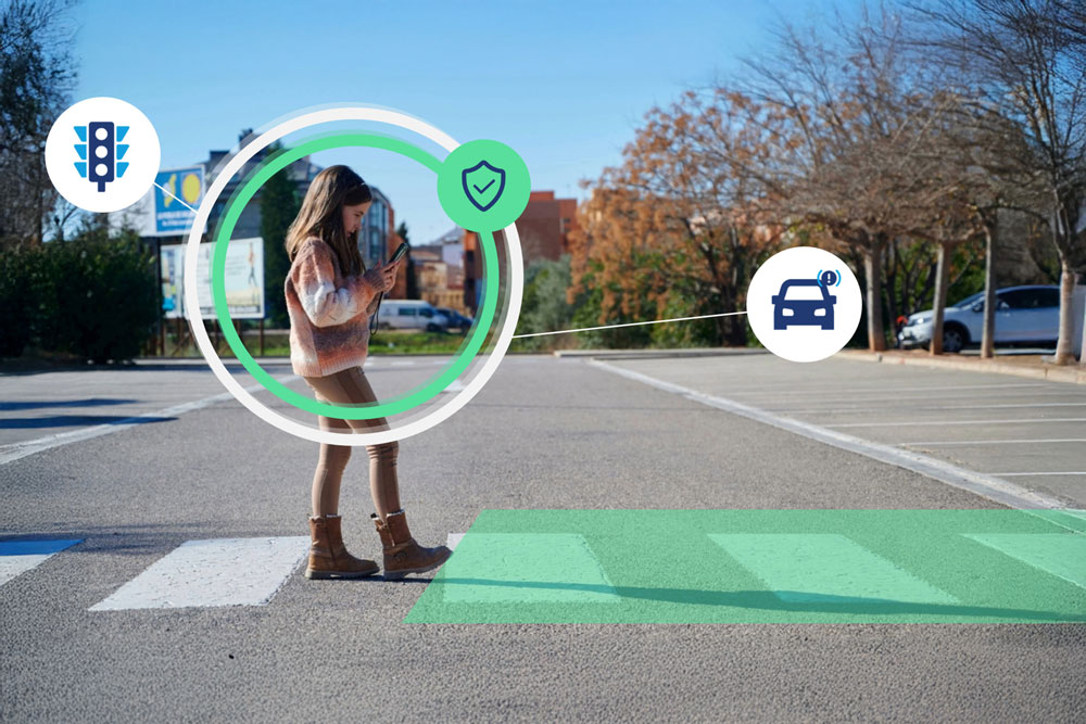 Smart car noticing person crossing a sidewalk looking at her phone