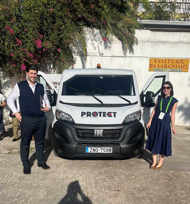 Jeandre Steenkamp and Olivia Hazell at the 2025 IFASIC Conference with the Protect Cash-In-Transit Vans