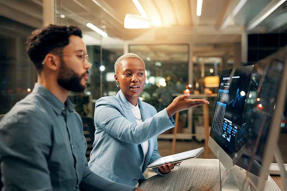 Computer screen, stock market and tablet with business people in office together for trading at night.