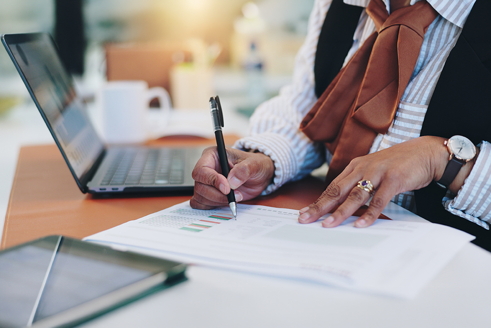 Writing, documents and hands of business person for planning, progress report and account manager.