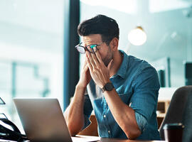 Burnout, fatigue and worker at computer with pain, brain fog and frustrated with mistake