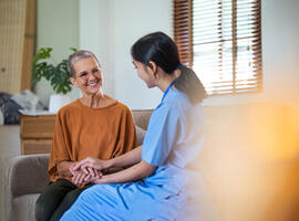 Page header picture of SCOR L&H Expert View titled Insurance Inclusivity and the Right to Be Forgotten with a carer and her patient