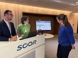 Teaser image of October 2025 SCOR Careers Blog Life At SCOR blog post about Sustainability Days with a sustainable IT booth and three people
