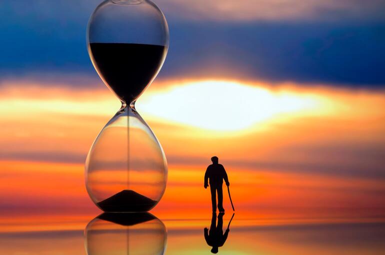 Hourglass with person silhouette