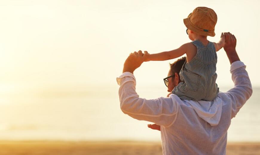 Man with his child on his shoulder