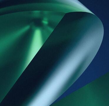 Abstract green curves against a dark blue background