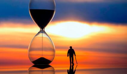 Hourglass with person silhouette