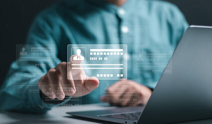 Businessman use laptop and hand touch virtual screen of digital identification card to accessing databases by digital identity for cyber security