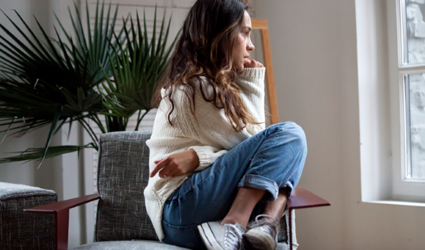 Young woman sitting in chair