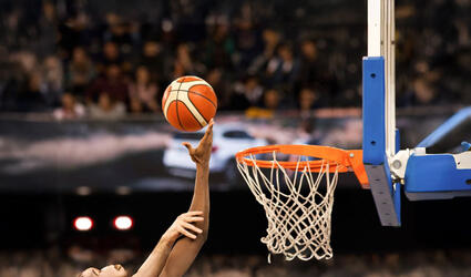 scoring during a basketball game - ball in hoop