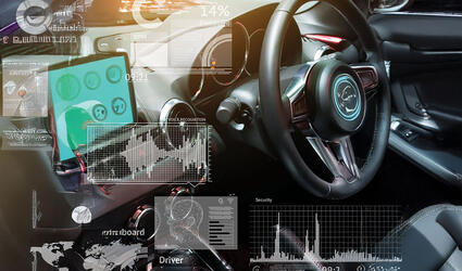 February 2025 SCOR P&C Expert View on Autonomous vehicles header with empty cockpit in vehicle and Self-Driving mode car graphic screen with flare light