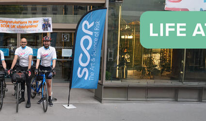 May 2025 Life at SCOR Careers Blog post header with the SCOR Champions on their bike