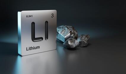 Periodic table symbol for lithium next to lithium stones