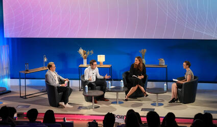 Header image of SCOR Careers Blog SCOR Live article with 3 speakers on the scene of SCOR's Paris office auditorium