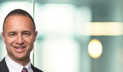 April 2025 SCOR Careers Blog Employee Spotlight header with Brock Robbins, CEO of SCOR Life & Health US