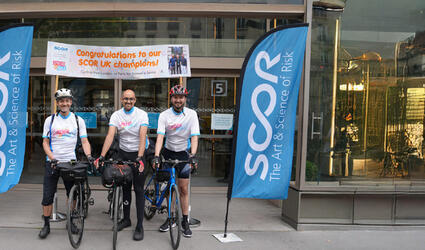 May 2025 Life at SCOR Careers Blog post header with the SCOR Champions on their bike