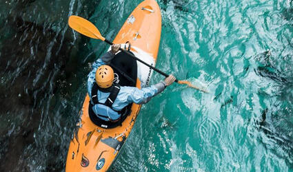 Man paddling on a river