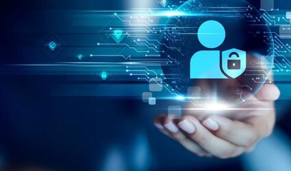Hand holding privacy icon against a blue background