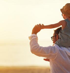 Man with his child on his shoulder