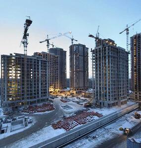 P&C Solutions page header with a buildings' construction site